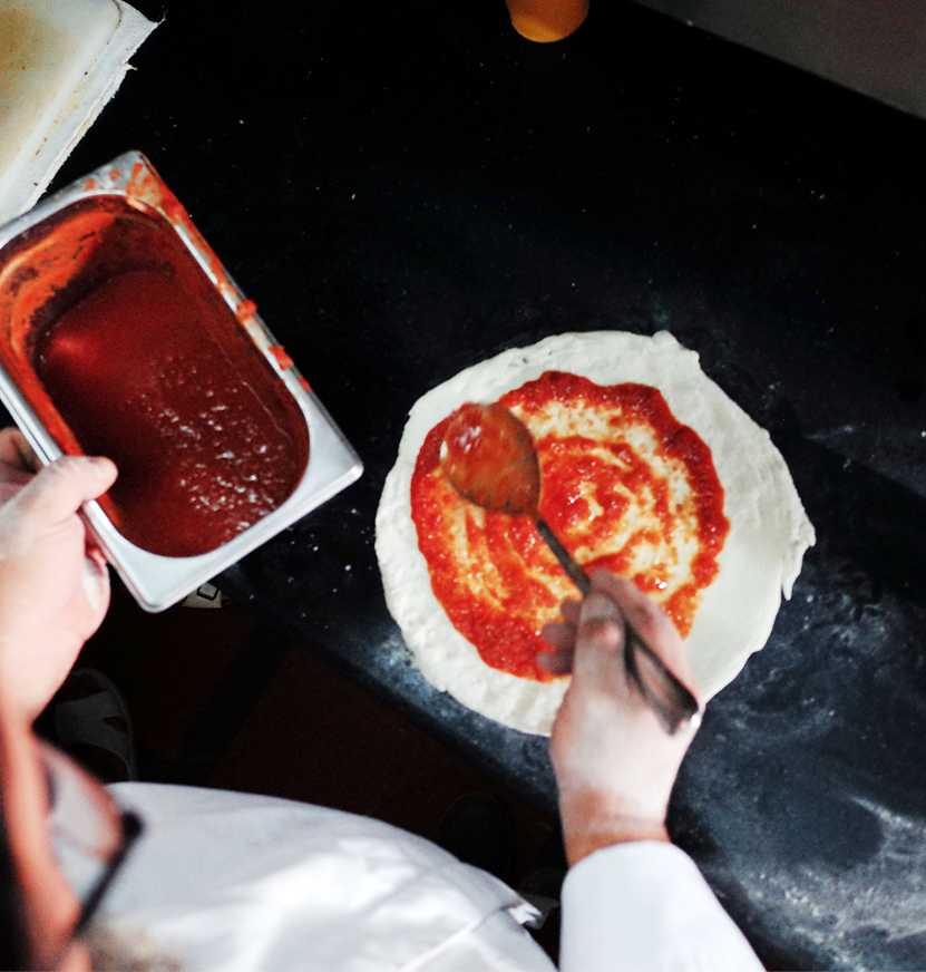pizzaiollo-making-pizza-by-hand